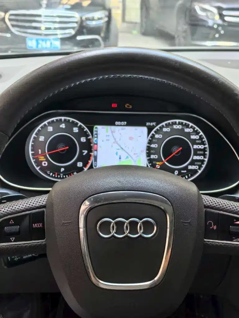 Audi Q5 digital cluster classic dial layout with navigation view