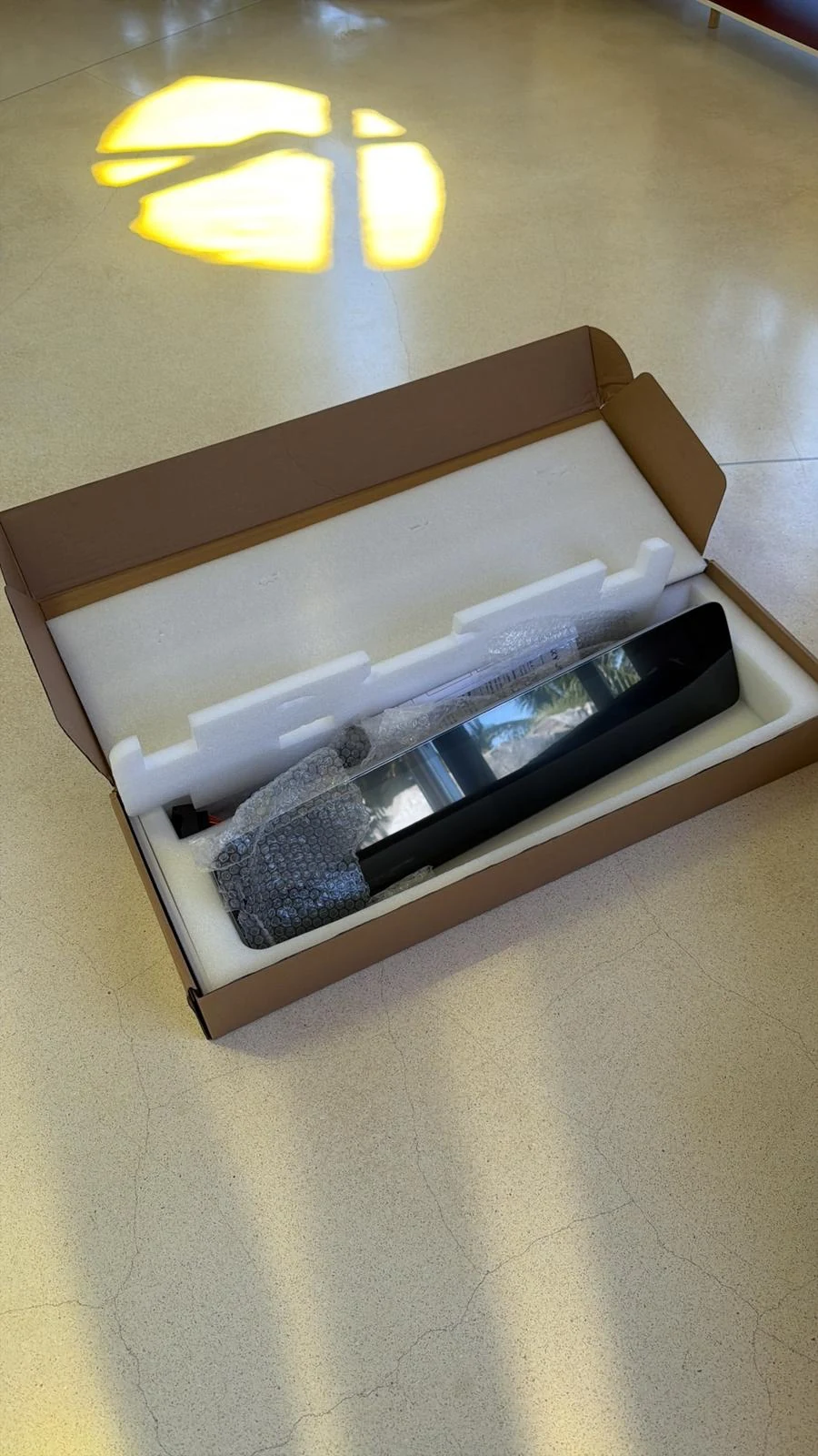 Large-format cockpit display secured inside shaped packaging foam