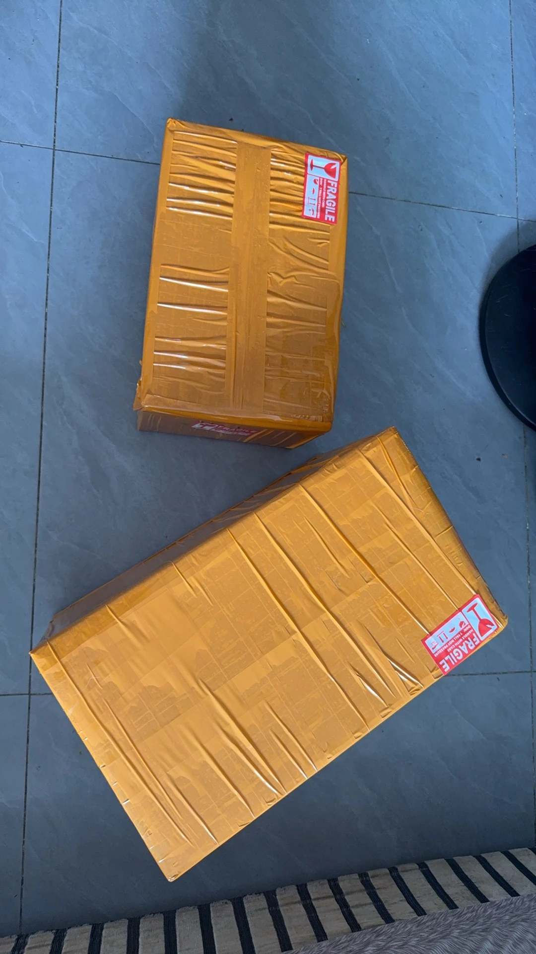 Sealed export cartons with fragile labels prepared for shipment