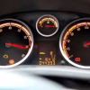 Traditional analog car instrument cluster with mechanical speedometer and tachometer
