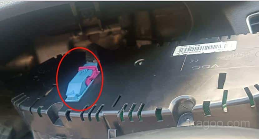 Disconnecting the original instrument power cable on a 2011-2015 Volkswagen Passat PQ