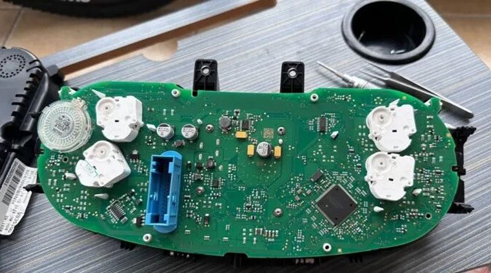 Volkswagen Passat PQ original instrument cluster housing opened on workbench