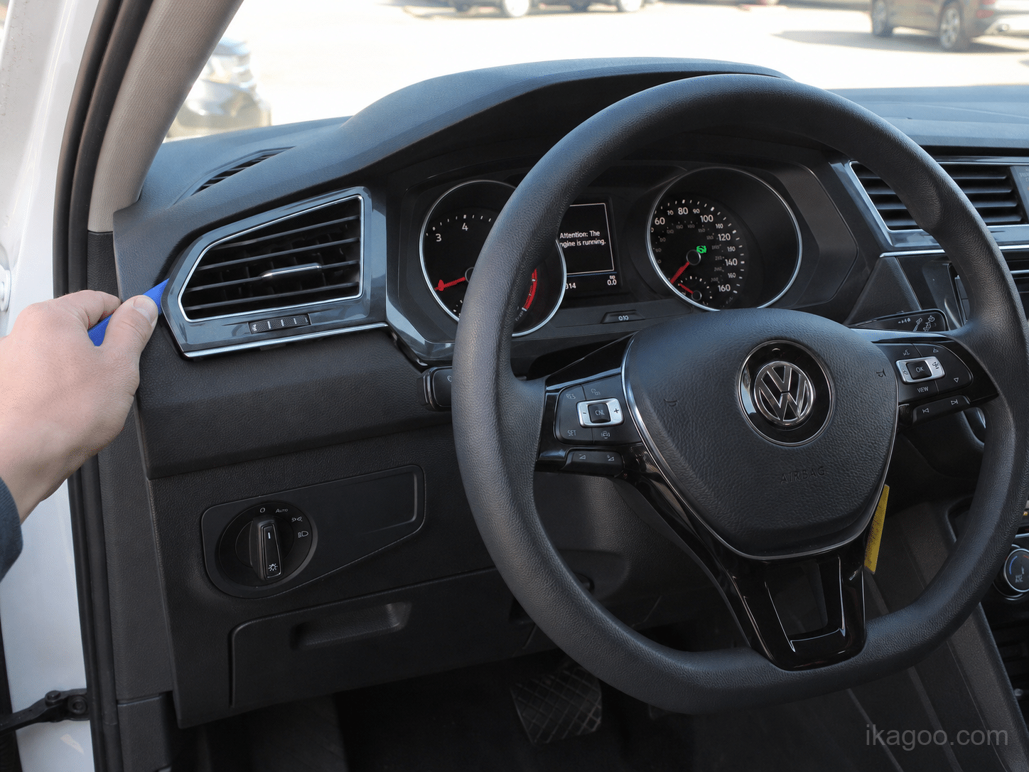 Prying open the left air vent edge for Volkswagen Tiguan 2017-2022 Full LCD Instrument Cluster installation