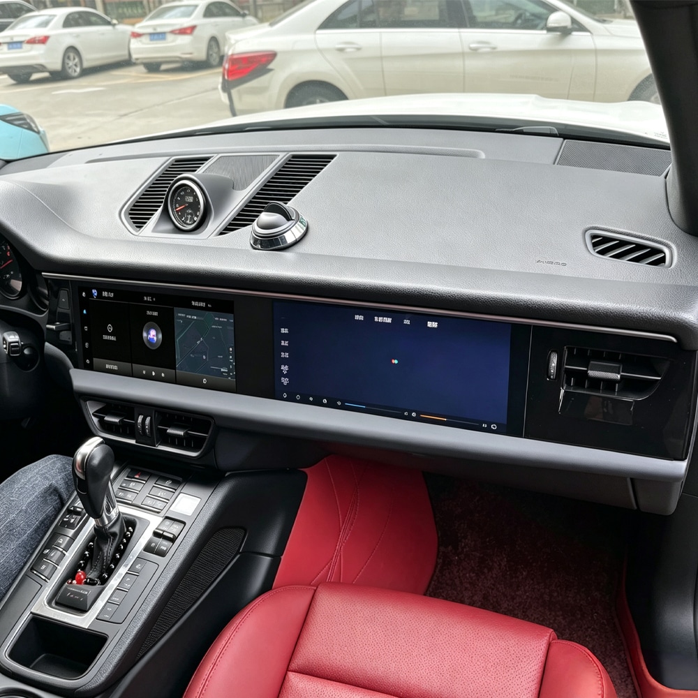 Porsche Macan dual screen installed in grey and red interior