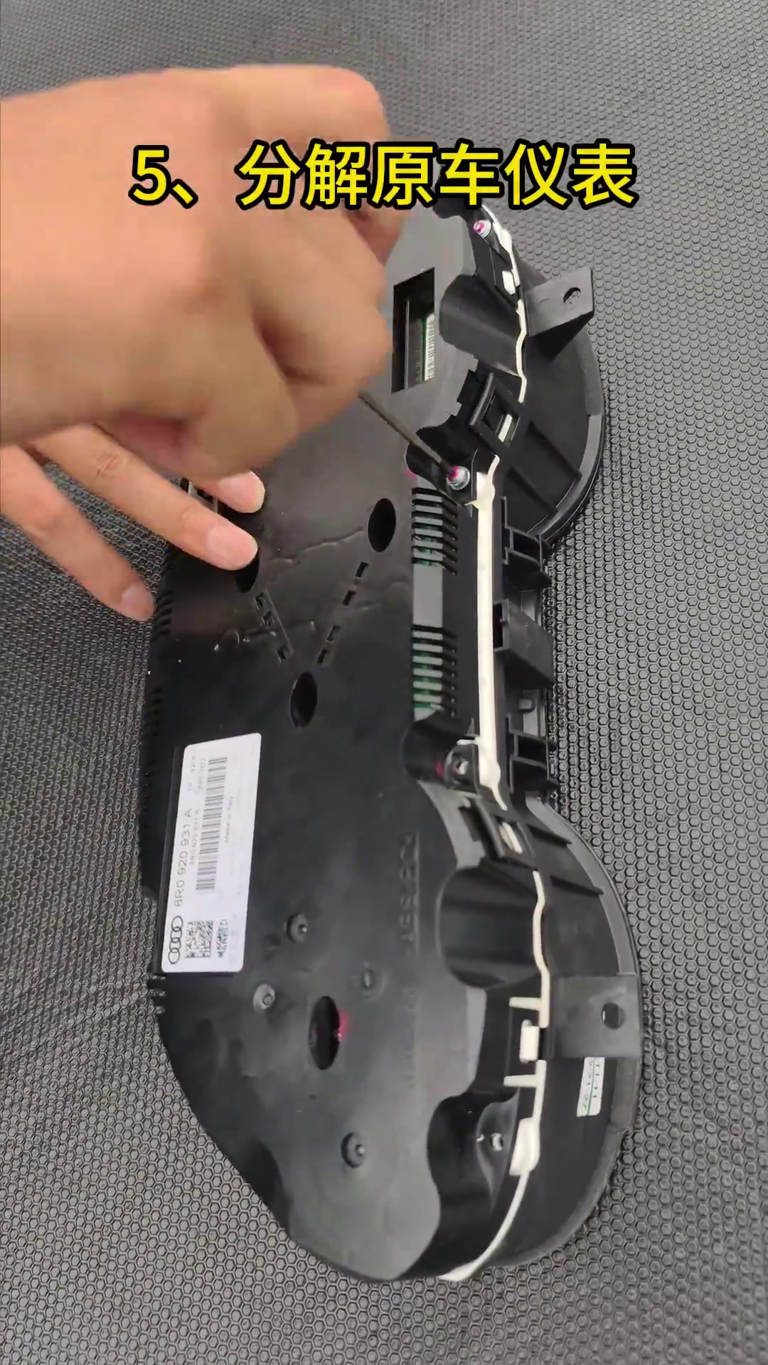 Open the original mechanical cluster on a clean padded bench before board transfer