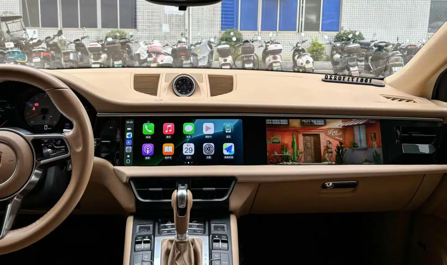 Porsche integrated cockpit showing driver display and center display performing different functions