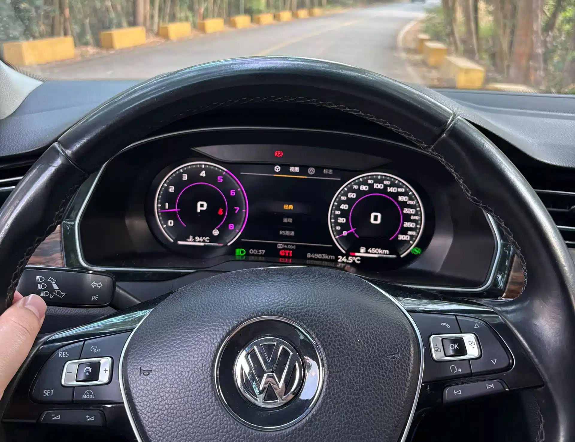 Volkswagen digital cluster showing speed gear range mileage temperature and warning indicators