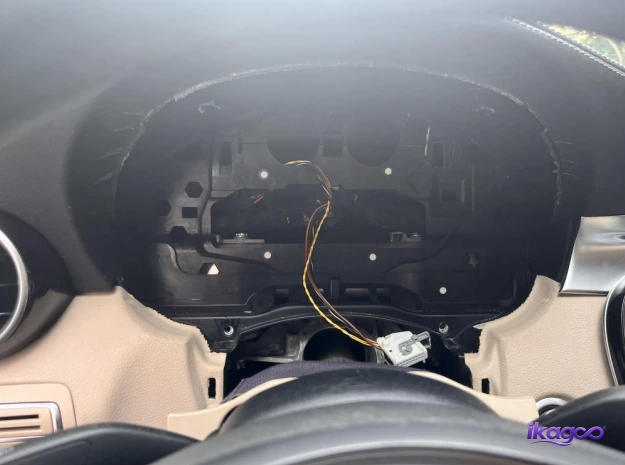 Original Mercedes W205 instrument cluster removed with the dashboard wiring exposed
