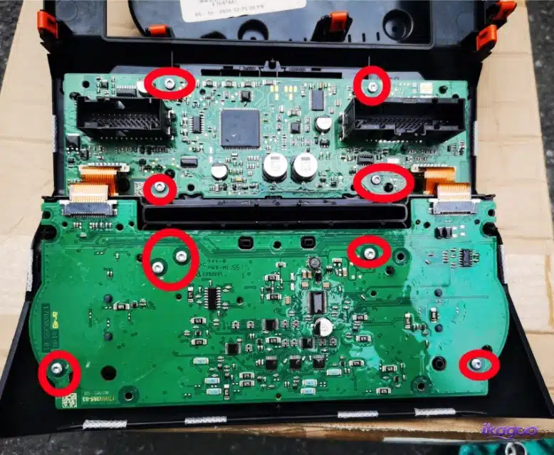 Ford F-150 climate-control board with retaining screws marked