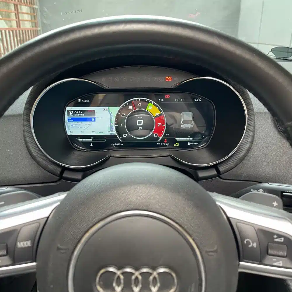 Audi TT Mk2 8J digital cluster showing CarPlay navigation with speed RPM and vehicle information