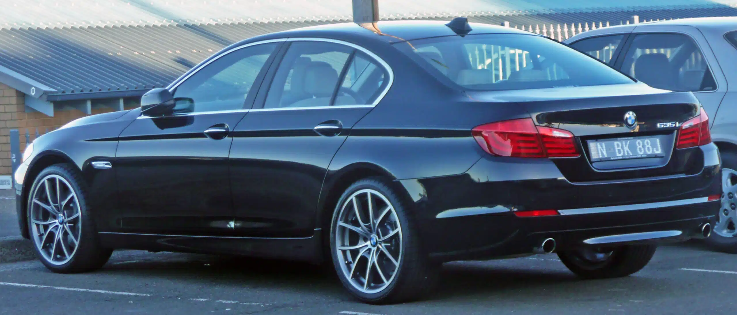 Original black BMW 535i F10 sedan exterior, representative of the 2010s BMW 5 Series generation