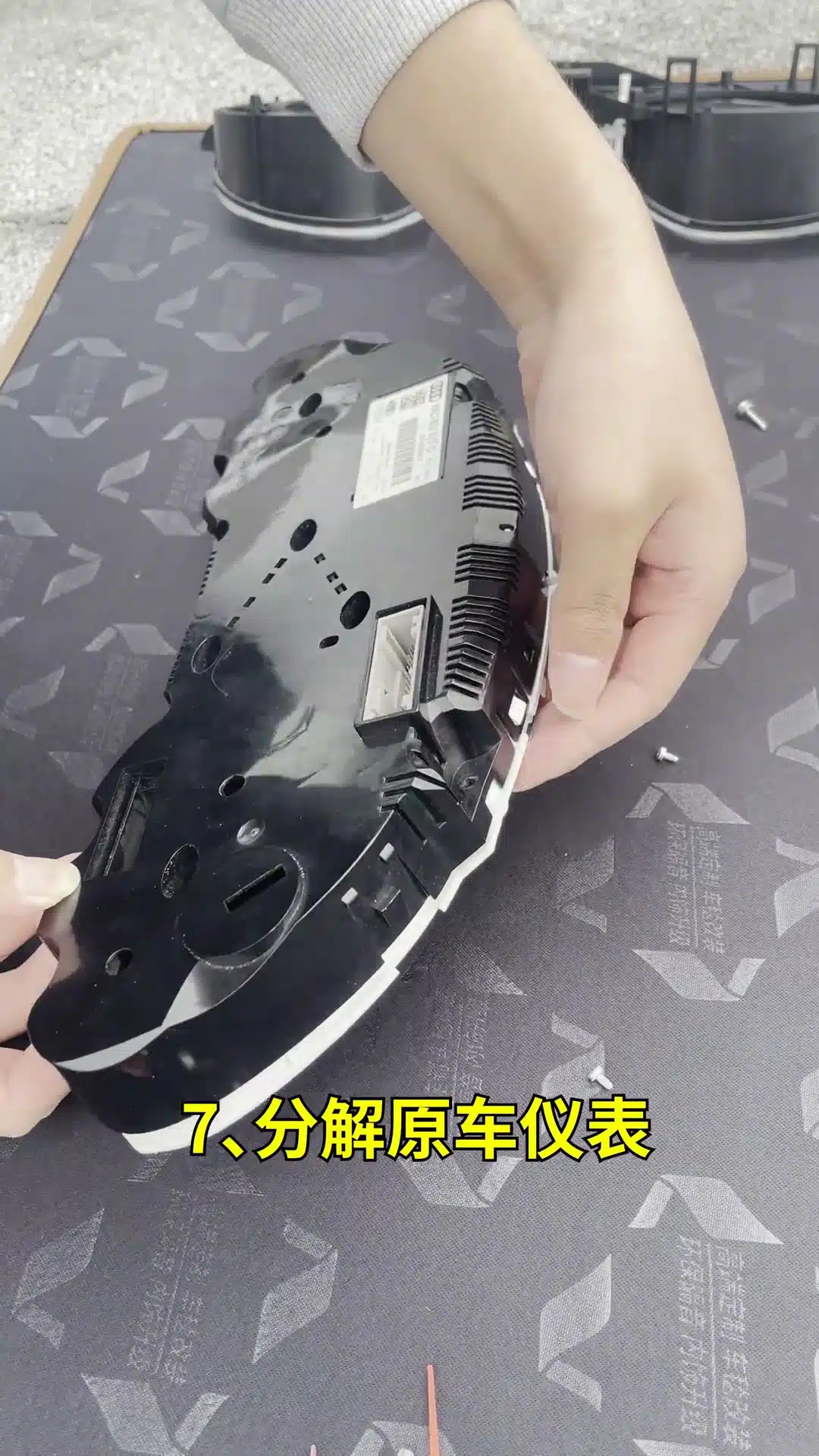 Audi original instrument cluster PCB being handled by its edges